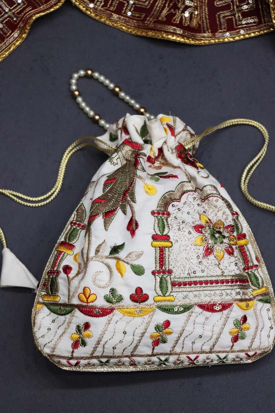 FANCY-COTTON-EMBROIDERY-WITH-SEQUENCE-WORK-AND-LACE-BORDER-WORK-POTLI-PURSE-FESTIVE-WEAR-WHOLESALE-PRICE-ETHNIC-GARMENT-2.jpeg