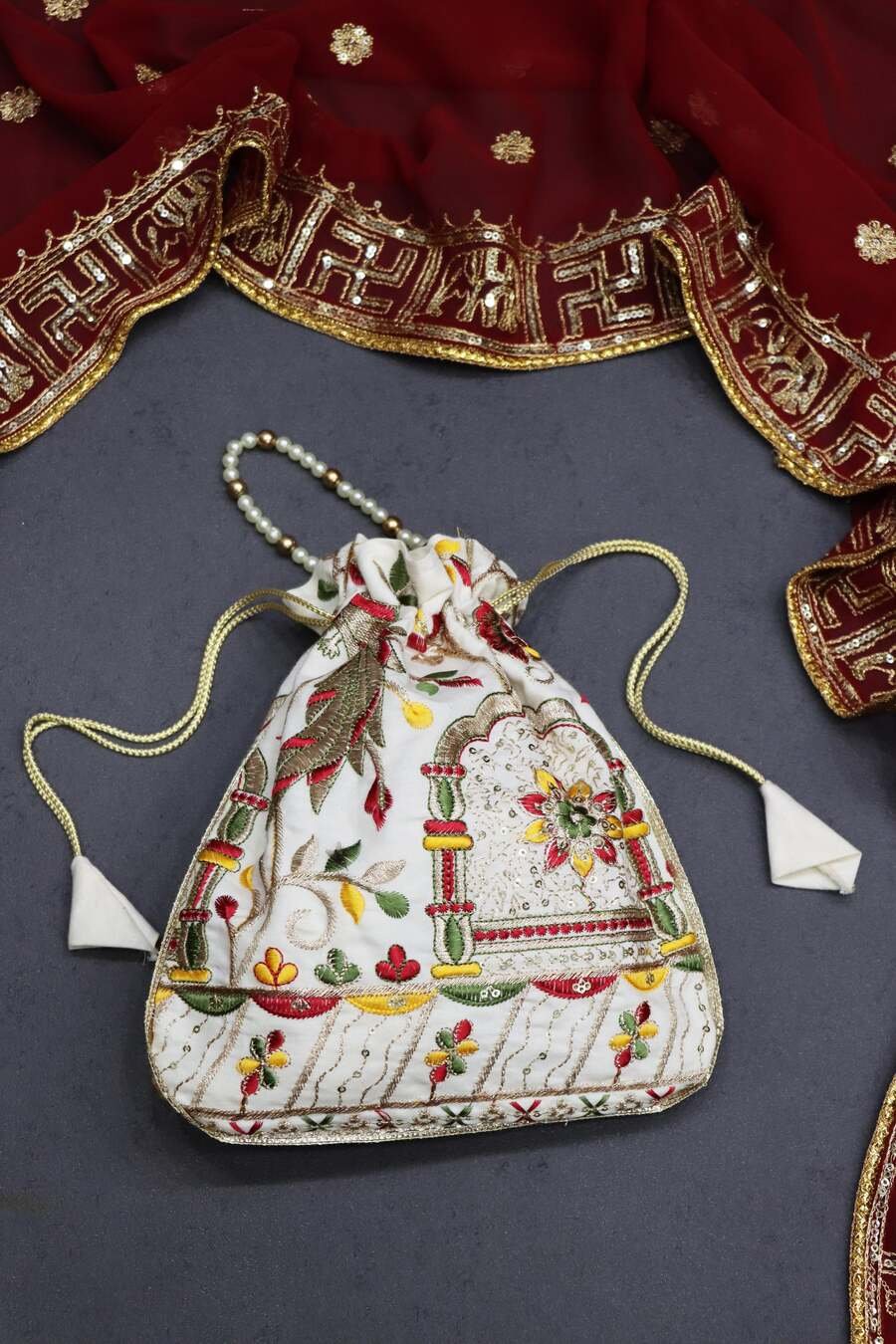 FANCY-COTTON-EMBROIDERY-WITH-SEQUENCE-WORK-AND-LACE-BORDER-WORK-POTLI-PURSE-FESTIVE-WEAR-WHOLESALE-PRICE-ETHNIC-GARMENT-2.jpeg